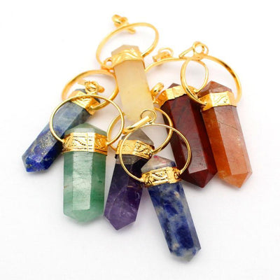 gold seven chakra point pendant set in a pille