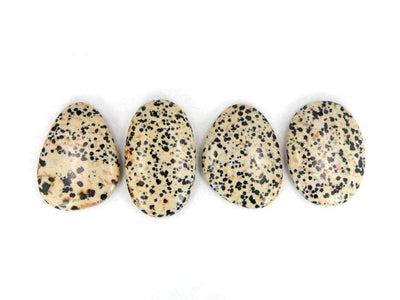 4 jasper beads displayed to show various characteristic differences between each stone