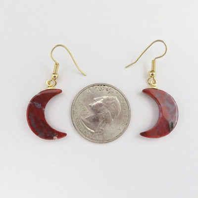 Gemstone Moon Dangle Earrings next to quarter for size comparison on a white background