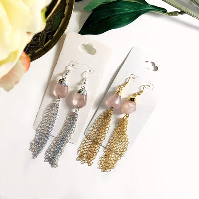 rose quartz gold and silver earrings displayed on white background