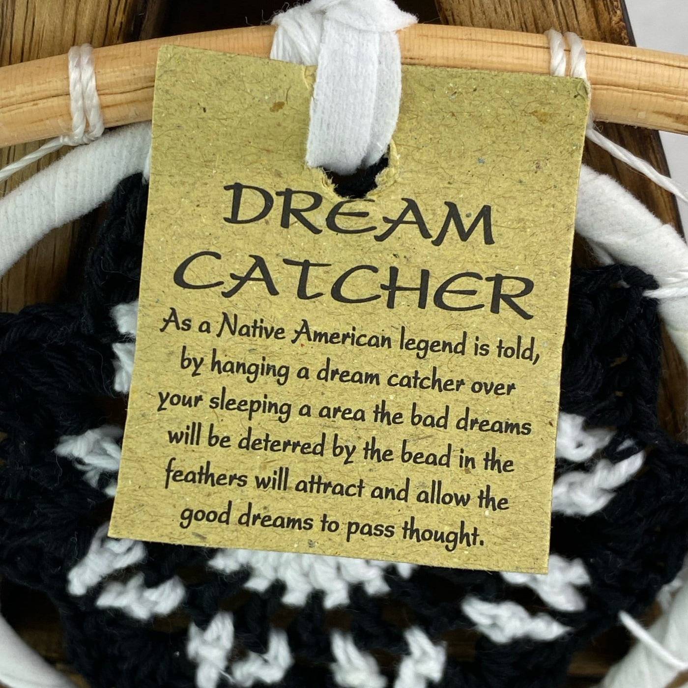 Tag on Dream catcher reads DREAM CATCHER As a native American legend is told, by hanging a dream catcher over your sleeping area the bad dreams will be deterred by the bead in the feathers will attract and allow the good dreams to pass thought.