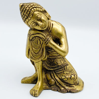 up close shot of Brass Resting Buddha Gold Head on Knee Statue on white background