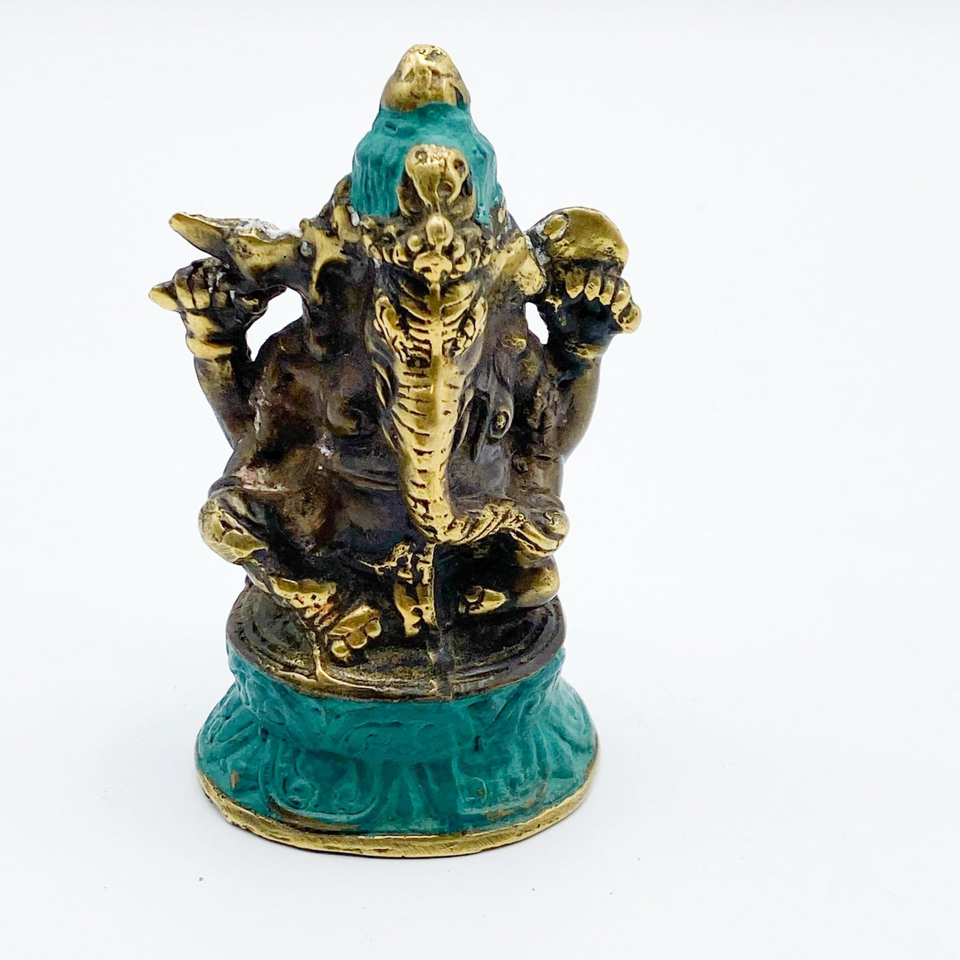 up close of the Brass Sitting Posture Elephant Lord Ganesha Mini Statue showing detail carving and design in the front