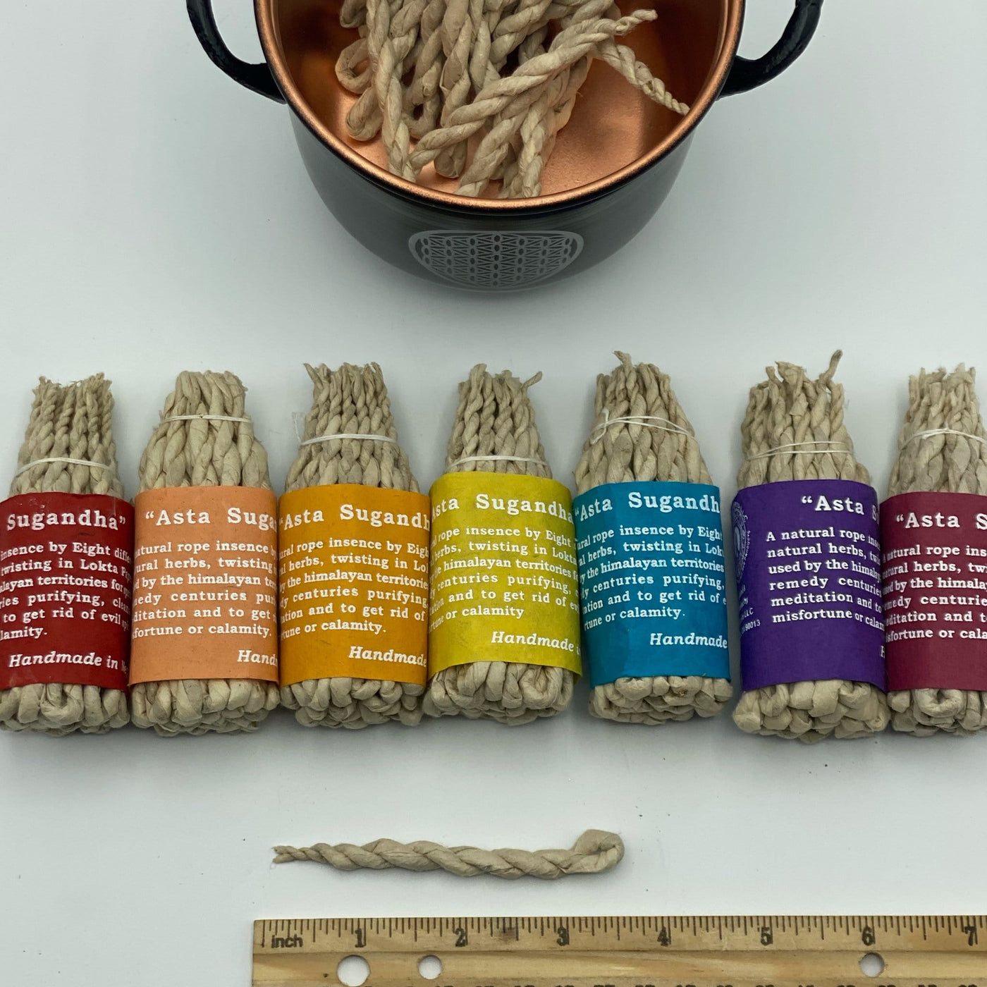 above angle of different Asta Sugandha rope incense bundles on a white background