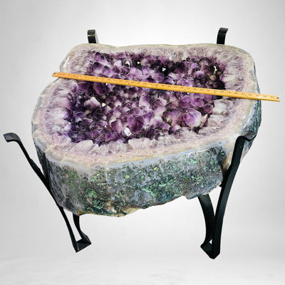 Amethyst Crystal Cluster Geode Table on Metal Base next to a yard stick for size reference