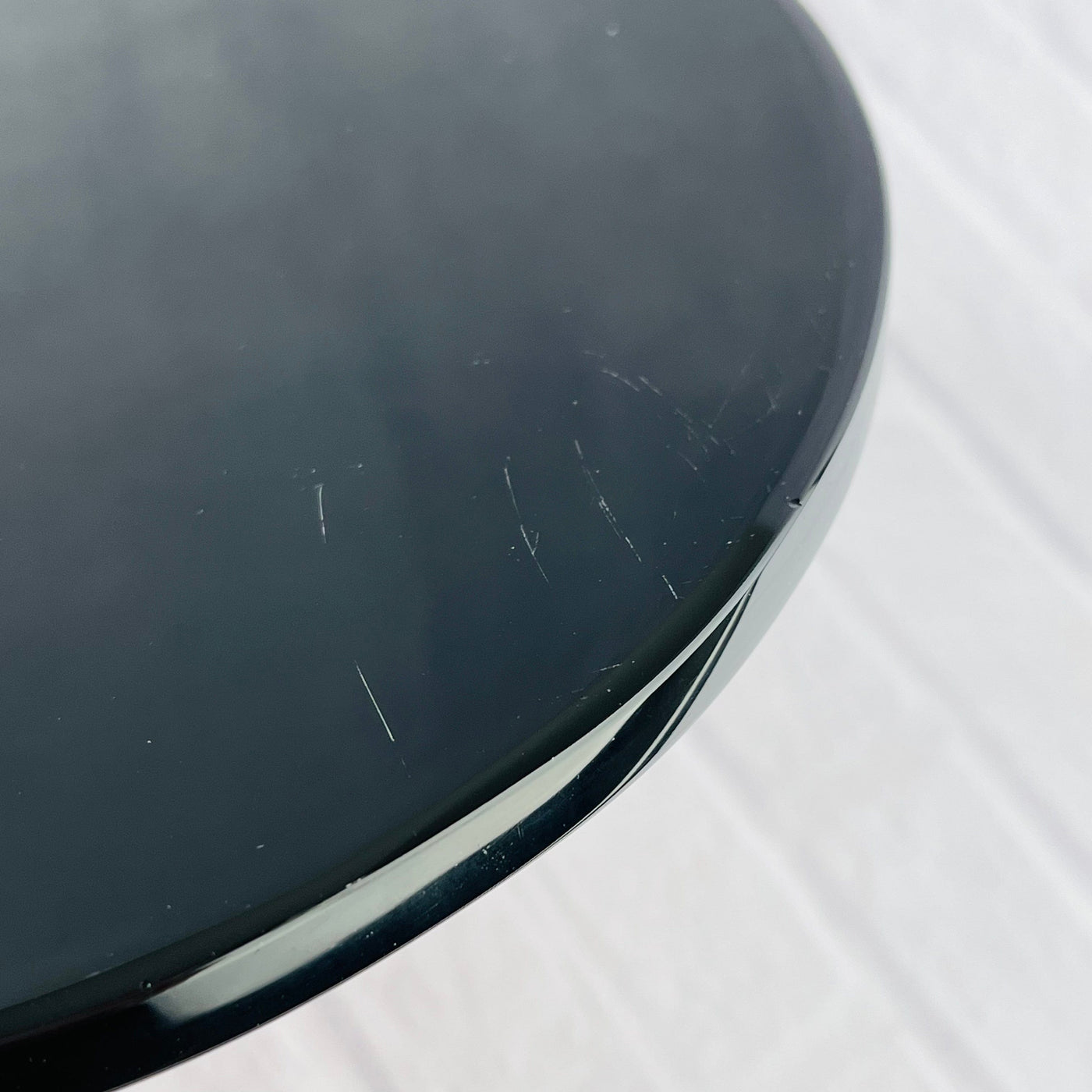 Up close view of minor scratches found on the back of Black Obsidian Flower of Life Plate.