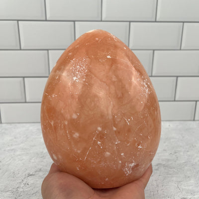  Peach Aventurine Polished Crystal Base - Palm fore size reference 