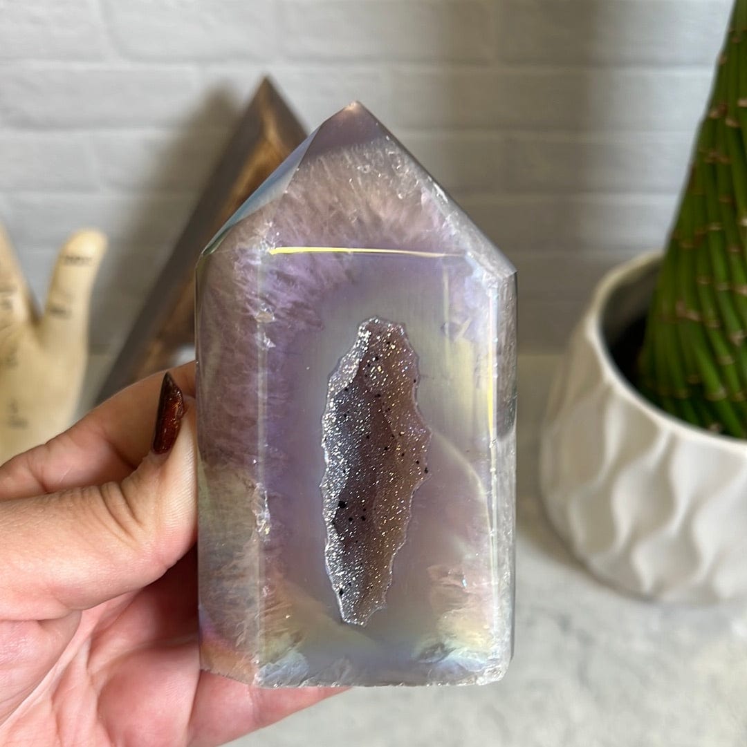 One agate druzy polished point with a light titanium coating to give it extra sparkle and a druzy center.