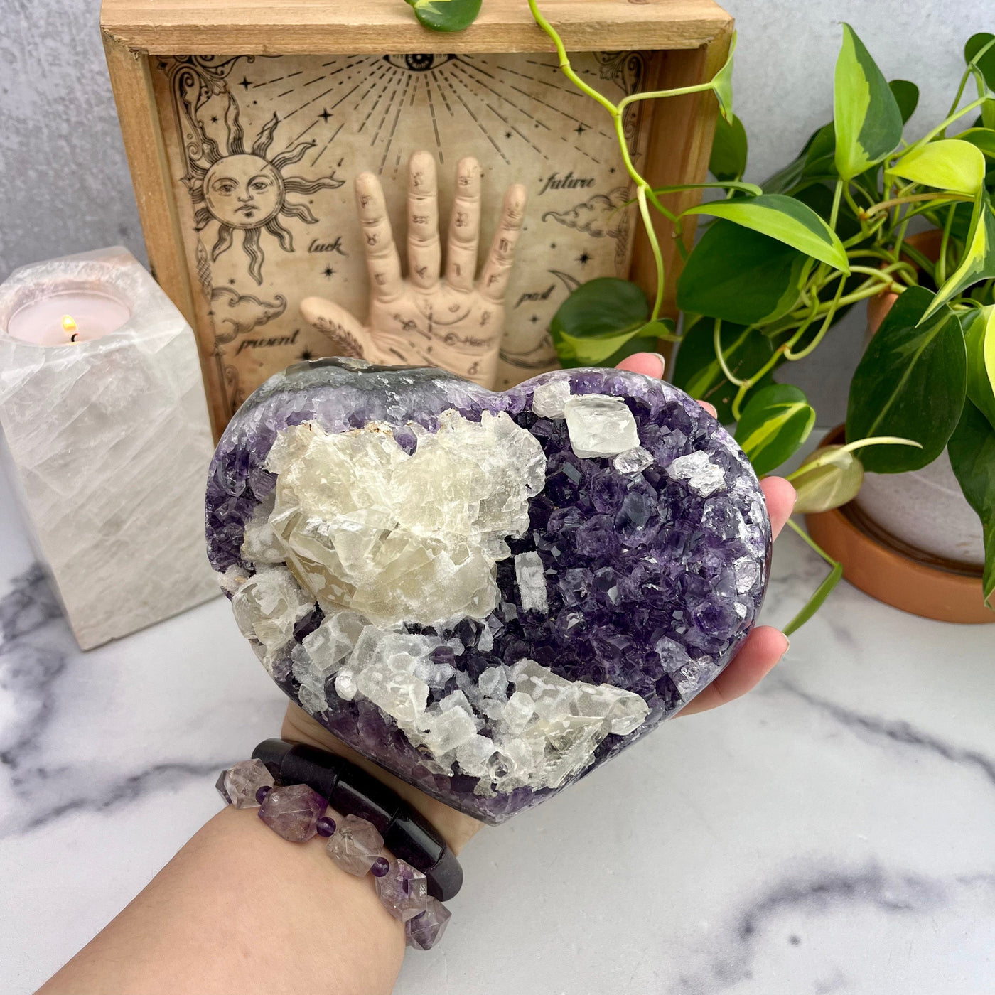 Purple Amethyst Cluster Heart with hand for size reference 
