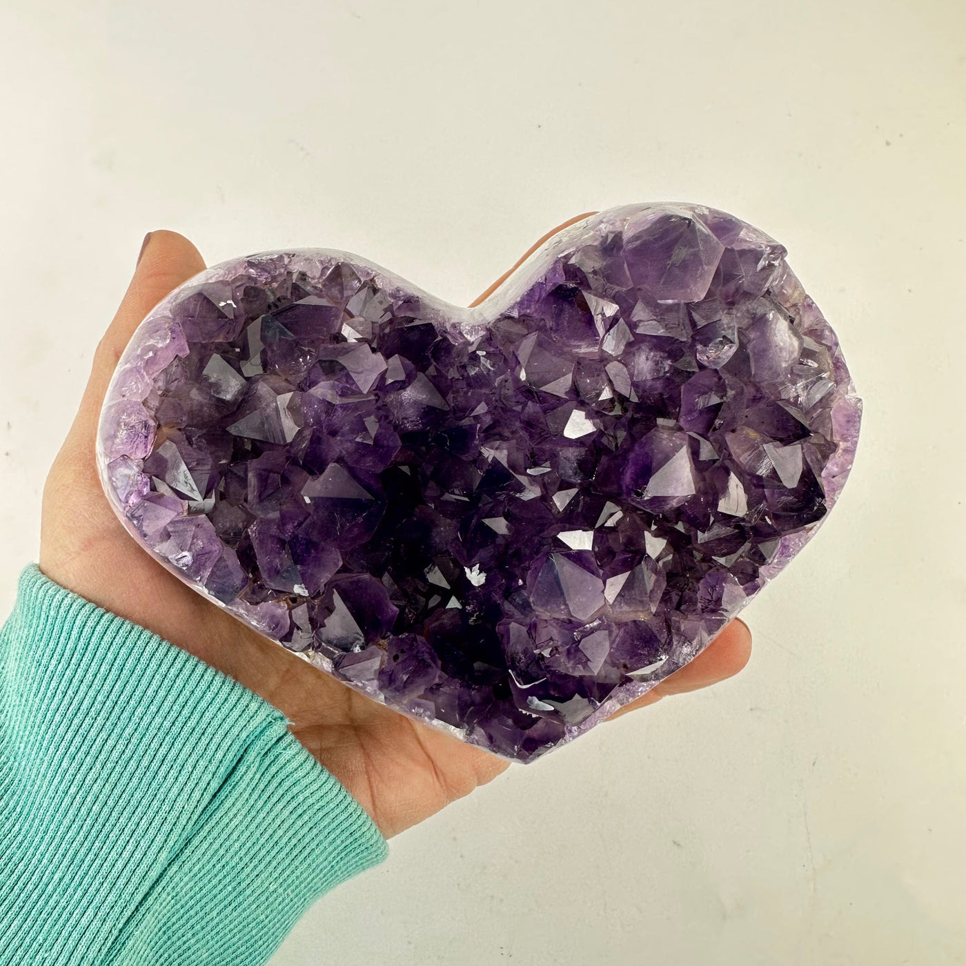 Amethyst Crystal Cluster Heart in a hand for size reference