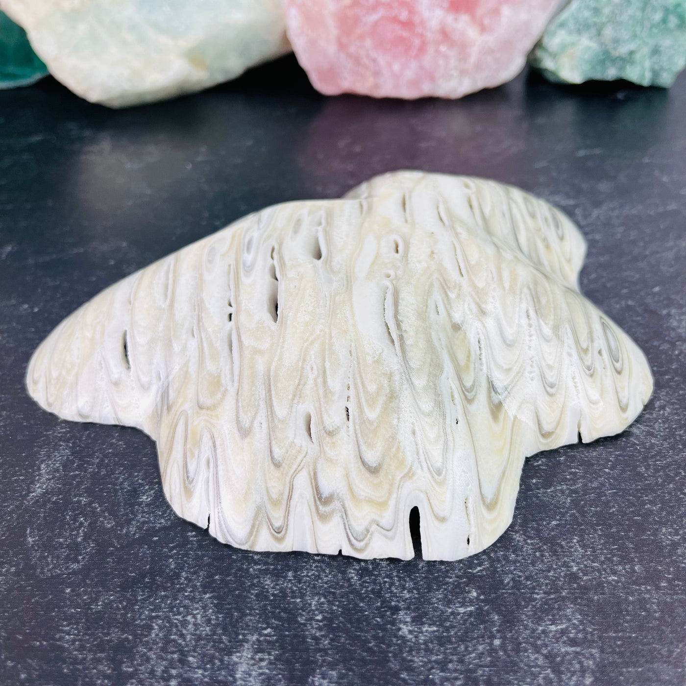 Mexican Patterned Onyx Freeform Bowl pictured lying on flat surface bottom up