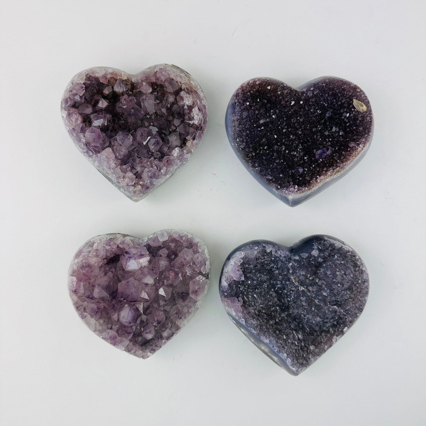 4 Amethyst Crystal Hearts lined up