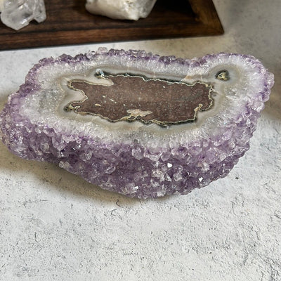 Amethyst stalactite formation.  The stalactite shows on the top and the bottom side is purple amethyst clusters.