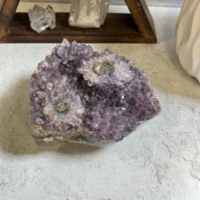 Amethyst stalactite cluster.  It has two stalactite eyes on the top.