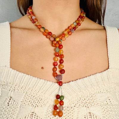 Gobi Desert Agate Mala Bead Necklace worn in lariat form, around woman's neck. 