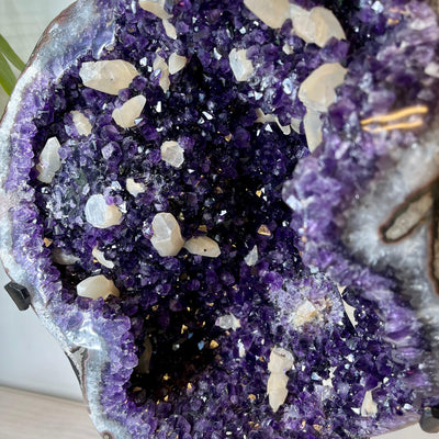 Up close view of crystal formations inside Large Dark Purple Amethyst and Calcite Geode.