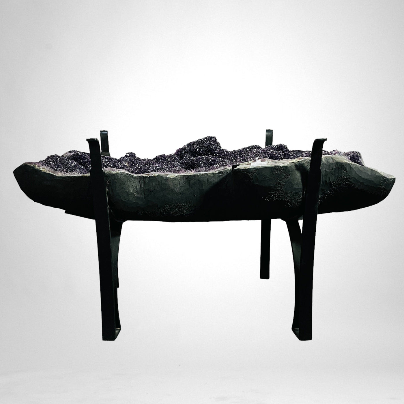 side view of Amethyst Crystal Geode Table on Metal Base on white background