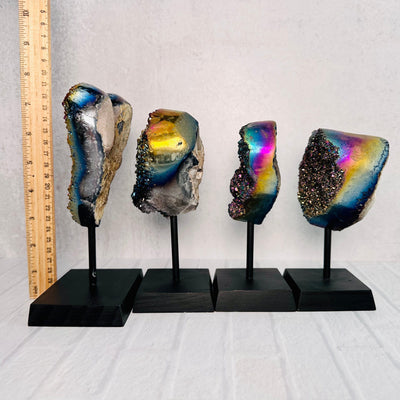 Side views of Titanium Hearts A, B, C, D, lined up from left to right, with an upright ruler next to them for size reference.