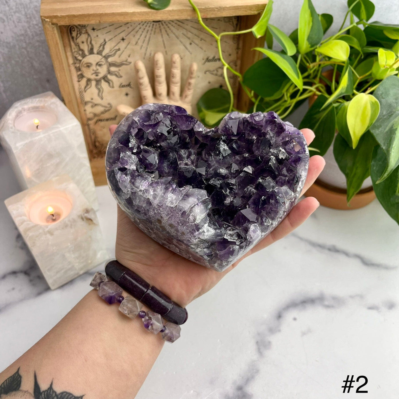 Druzy Purple Amethyst Hearts Top view of choice number two with hand for size reference 