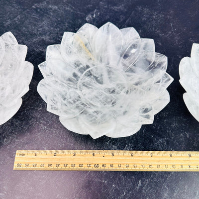 Crystal  Quartz Lotus Bowl next to a ruler for size reference.