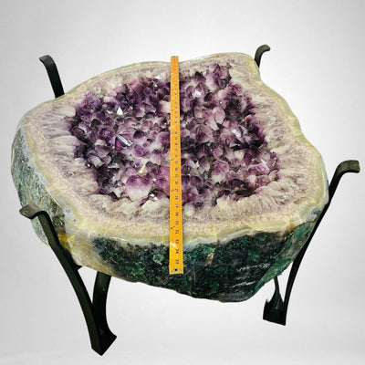 Amethyst Crystal Cluster Geode Table on Metal Base with yard stick on top of it for size reference
