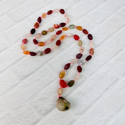 Gobi Desert Agate Beaded Necklace laid out on a white surface.
