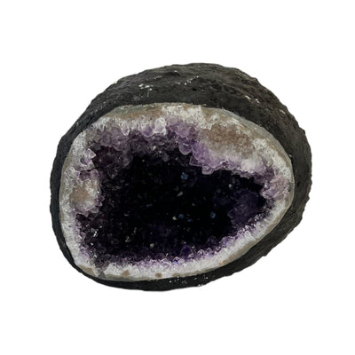 Round amethyst geode on a white background.