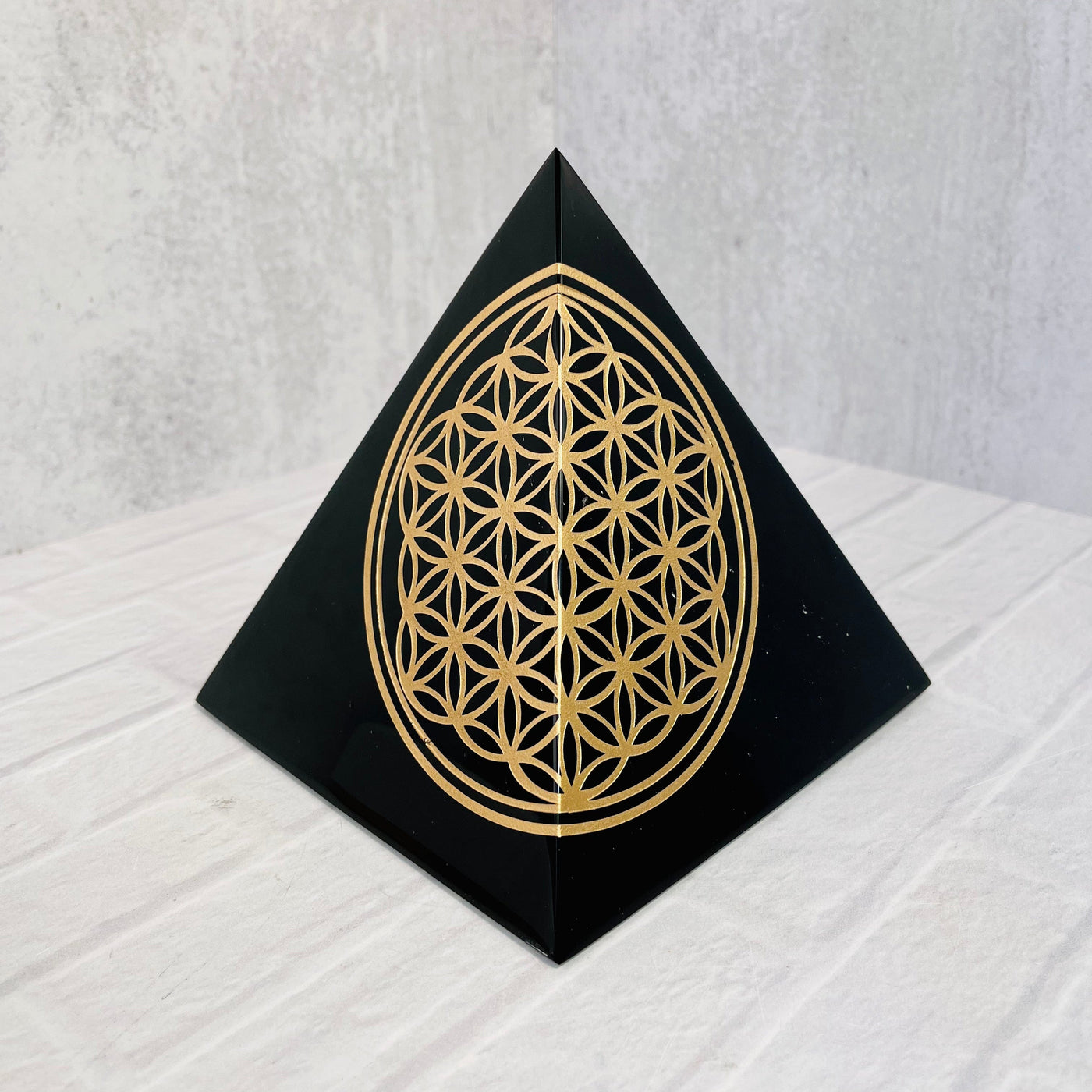 Frontal view of Gold Sheen Obsidian Flower of Life Pyramid.