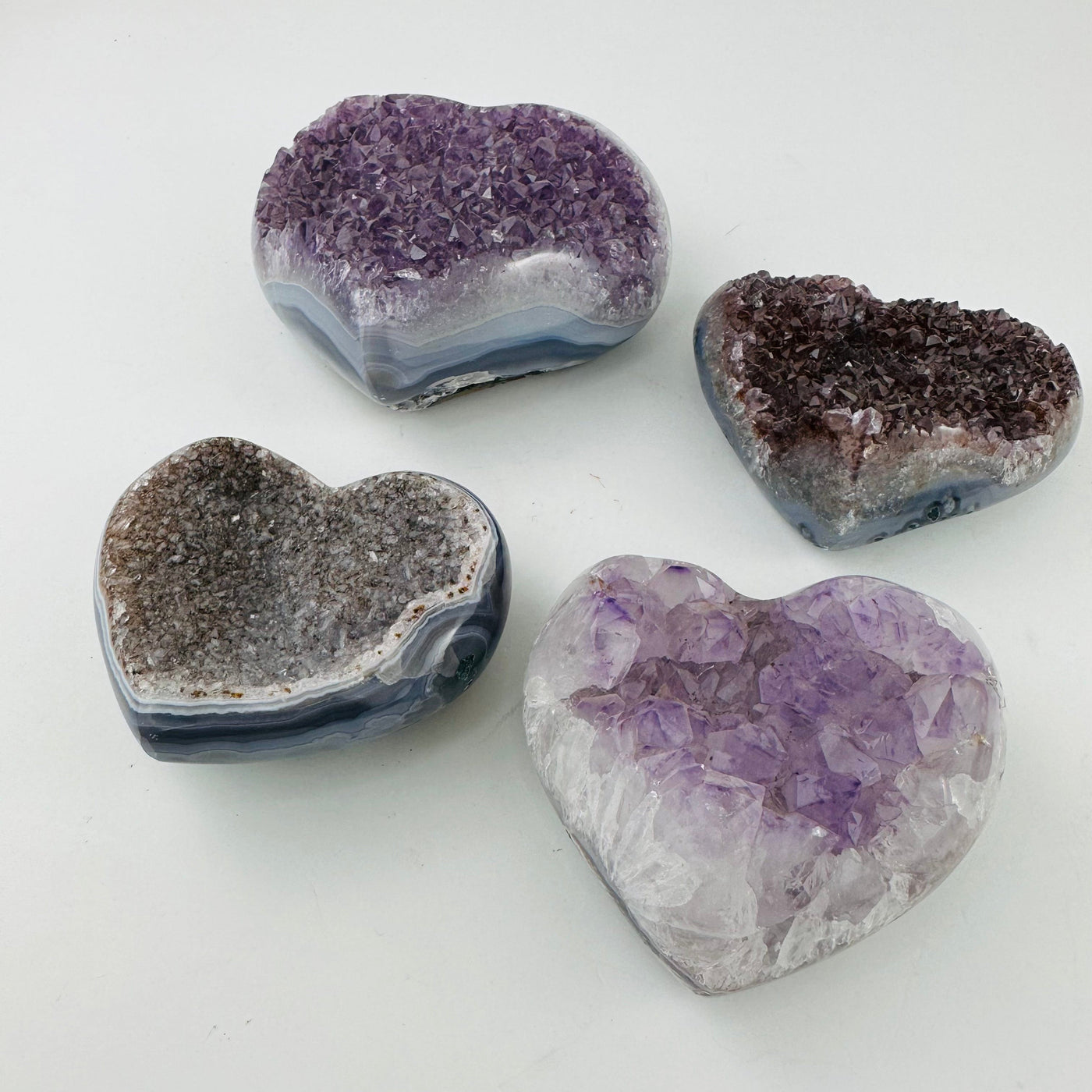 Amethyst Crystal Gemstone Hearts at an angle to show thickness