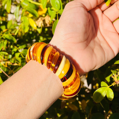 backside view of Baltic Amber Bracelet, worn on woman's wrist.