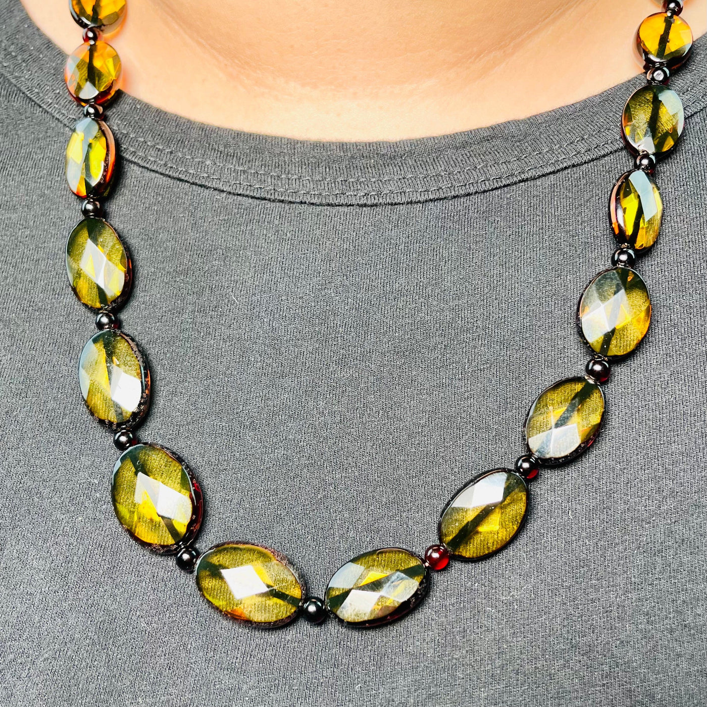 Baltic Amber Beaded Necklace pictured worn by a woman.