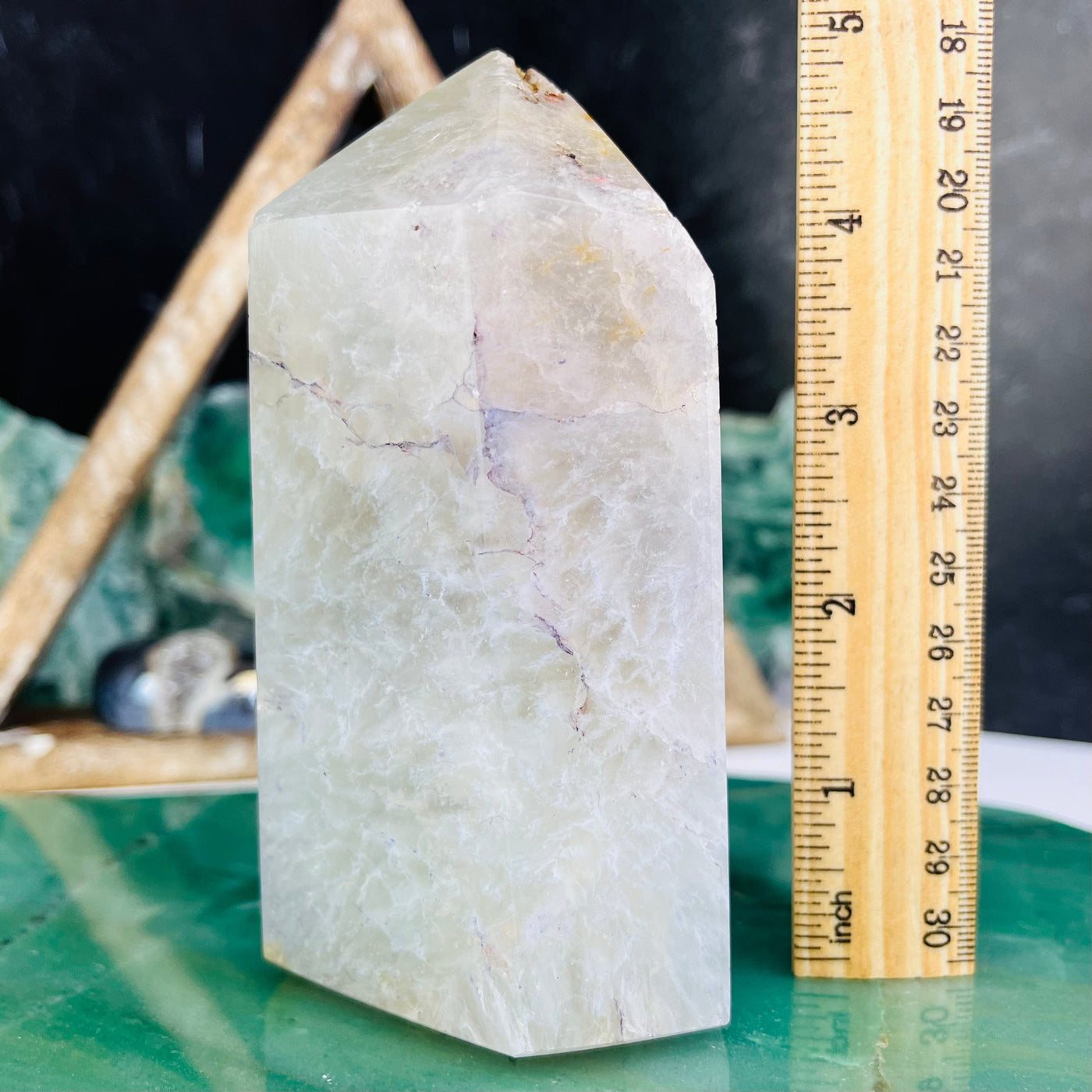 Side view of Agate Druzy Polished Point - Light Purple Dye, pictured next to ruler for size reference.