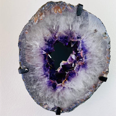 Front view of Amethyst Mirror mounted on wall