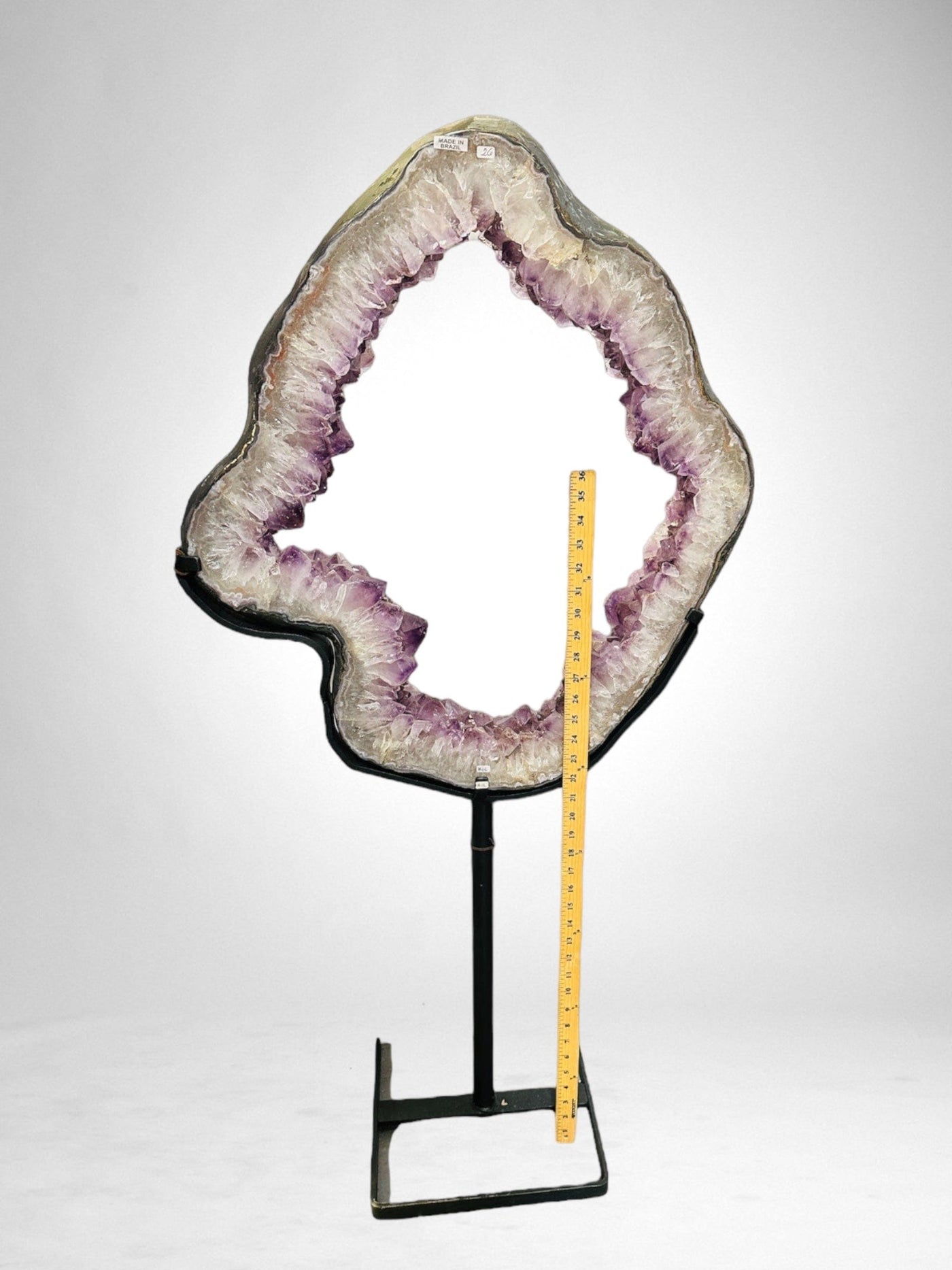 Large Amethyst Portal on Metal Stand on white background next to a yard stick for size reference