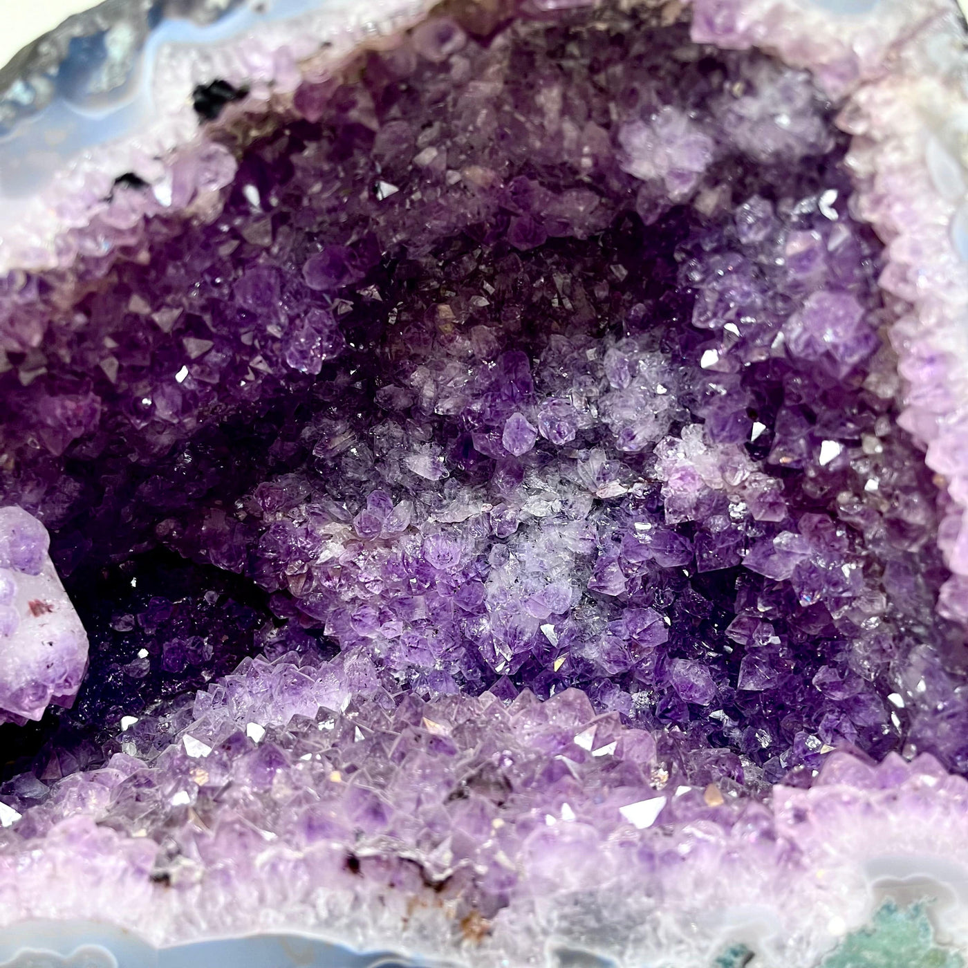 Up close view of the inner cluster formation of the Amethyst Cluster Geode Cave.