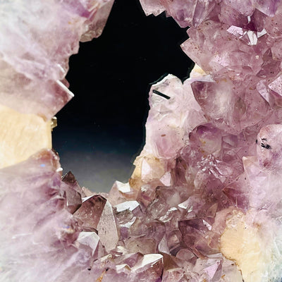 Up close view of clusters on Amethyst Cluster Mirror with Calcite