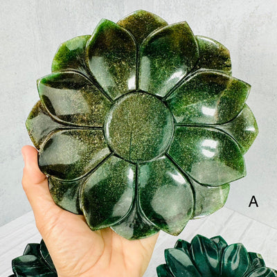 Green Quartz Lotus Bowl A held up in woman's hand.