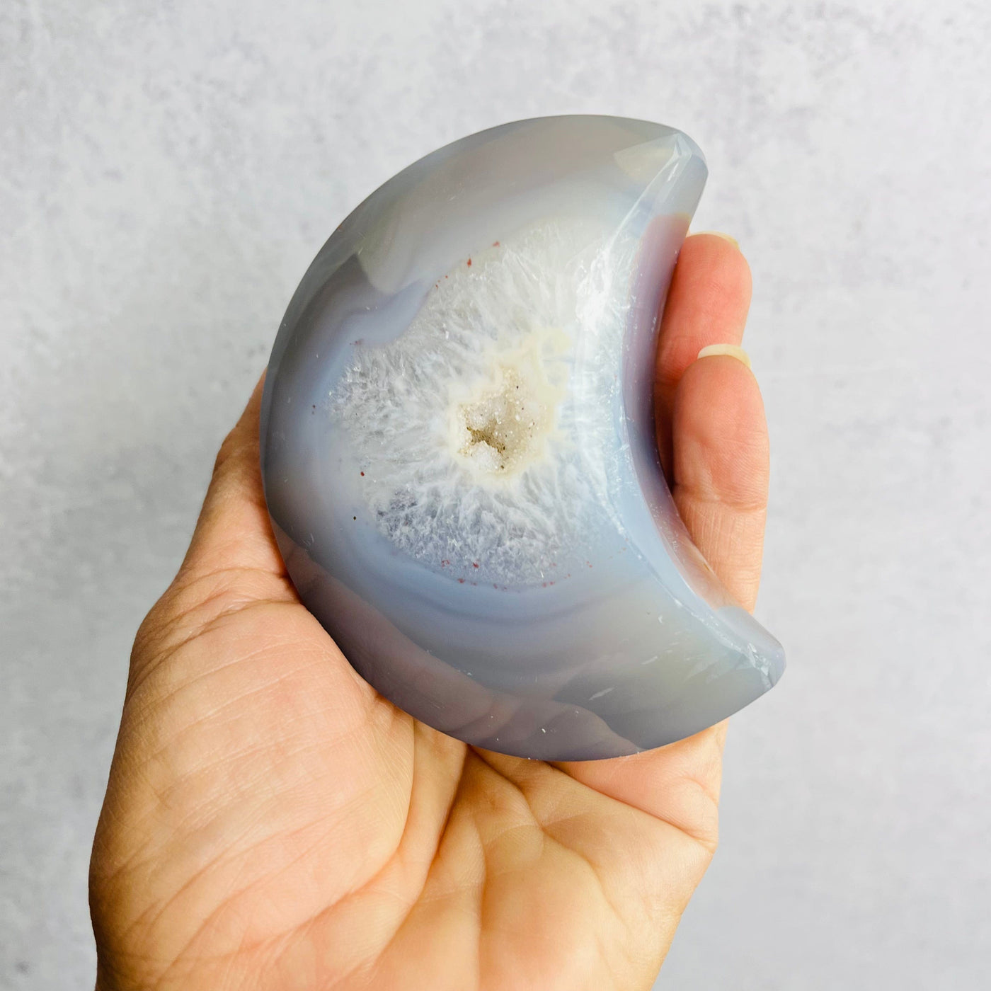 Frontal view of Natural Agate Crescent Moon in hand