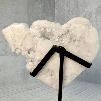 Up close back view of Crystal Quartz Cluster Heart on Metal Stand.