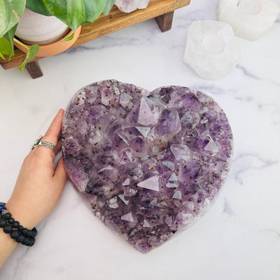 Amethyst Druzy Heart Crystal Top View With Hand For Size Reference 