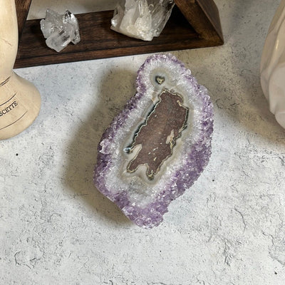 Amethyst stalactite formation.  The stalactite shows on the top and the bottom side is purple amethyst clusters.