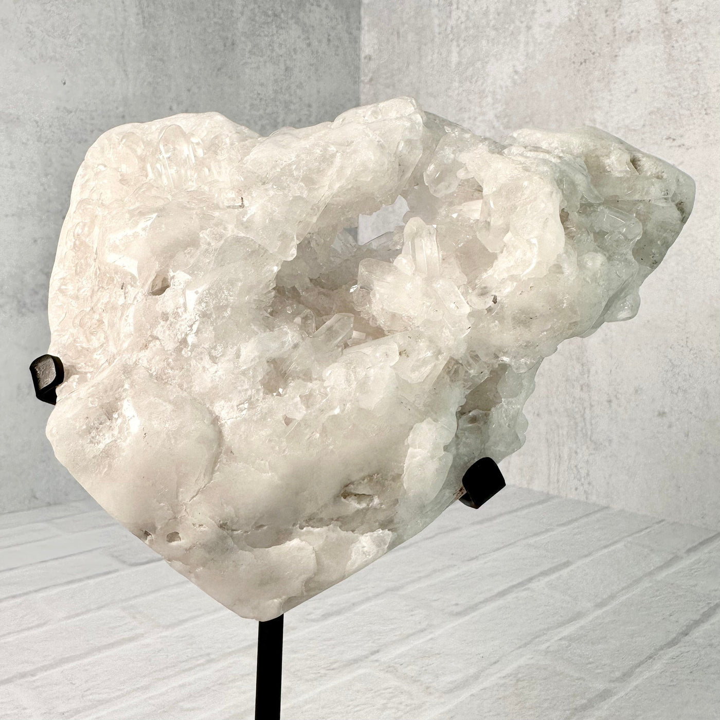 Up close frontal view of Crystal Quartz Cluster Heart on Metal Stand.