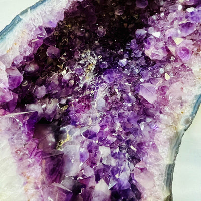 Up close view of the clusters within the right Large Amethyst Sliced Geode Wing