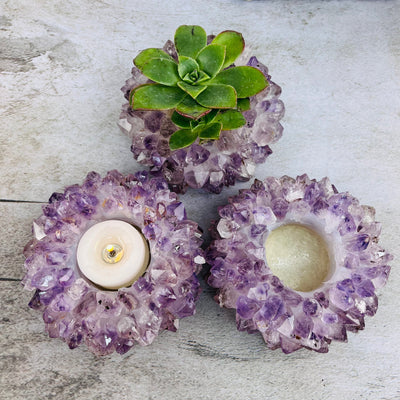 Amethyst Point Candle Holders, one with a candle in it, one with a succulent in it