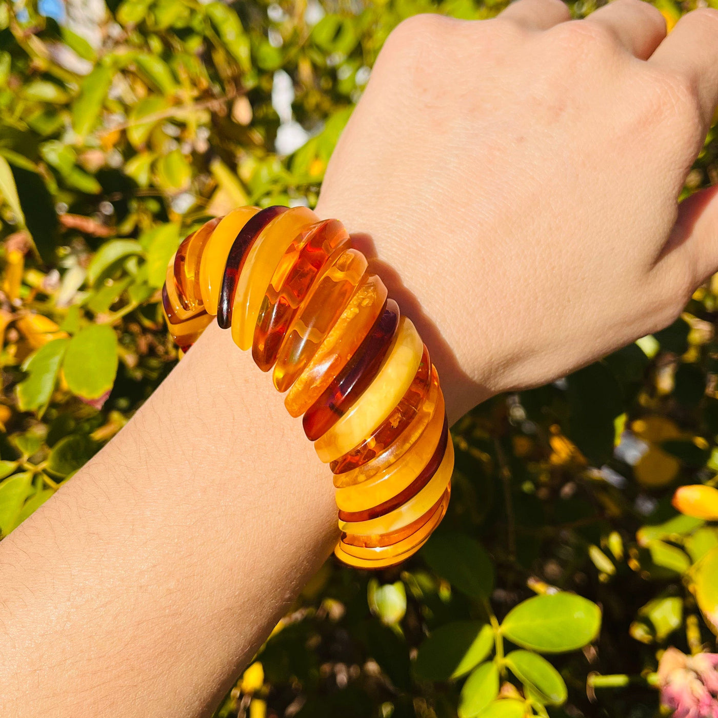 Frontal view of Baltic Amber Bracelet, worn on woman's wrist.