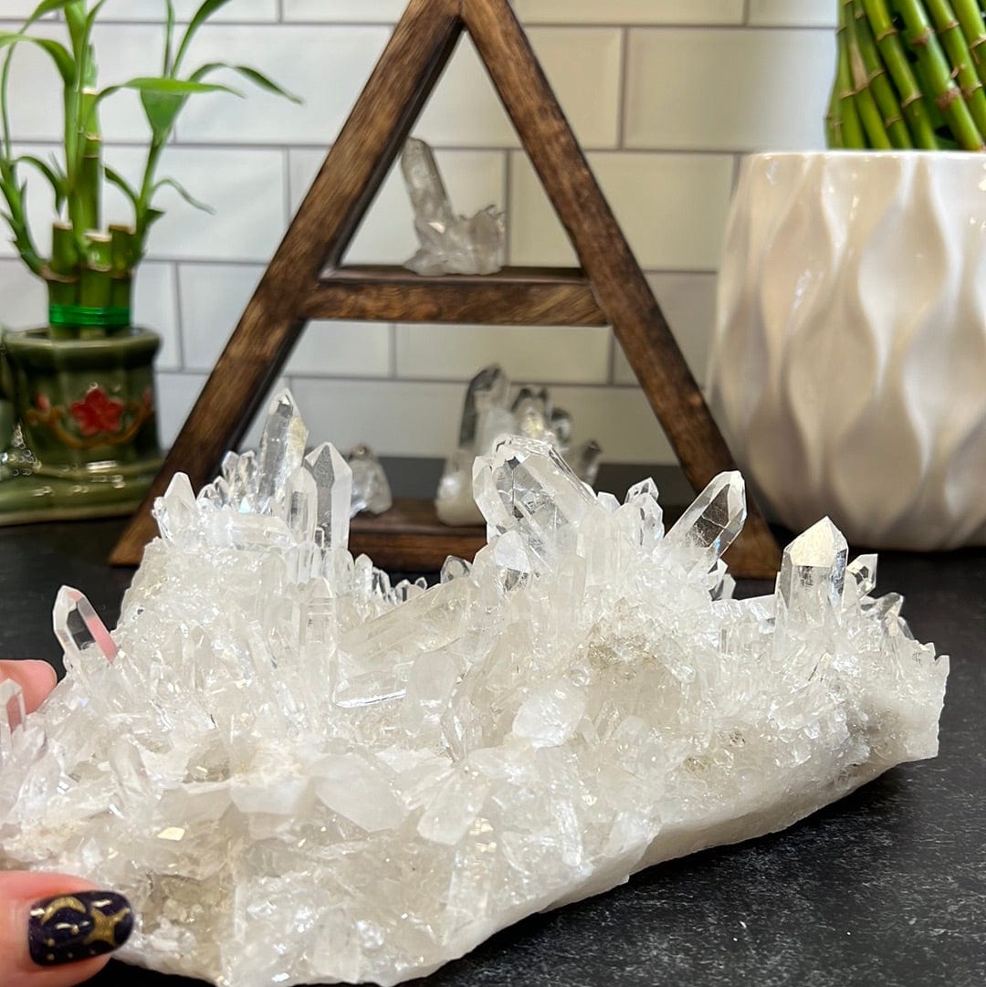 Large Crystal Quartz Cluster with clear points radiating in all directions all over the piece.