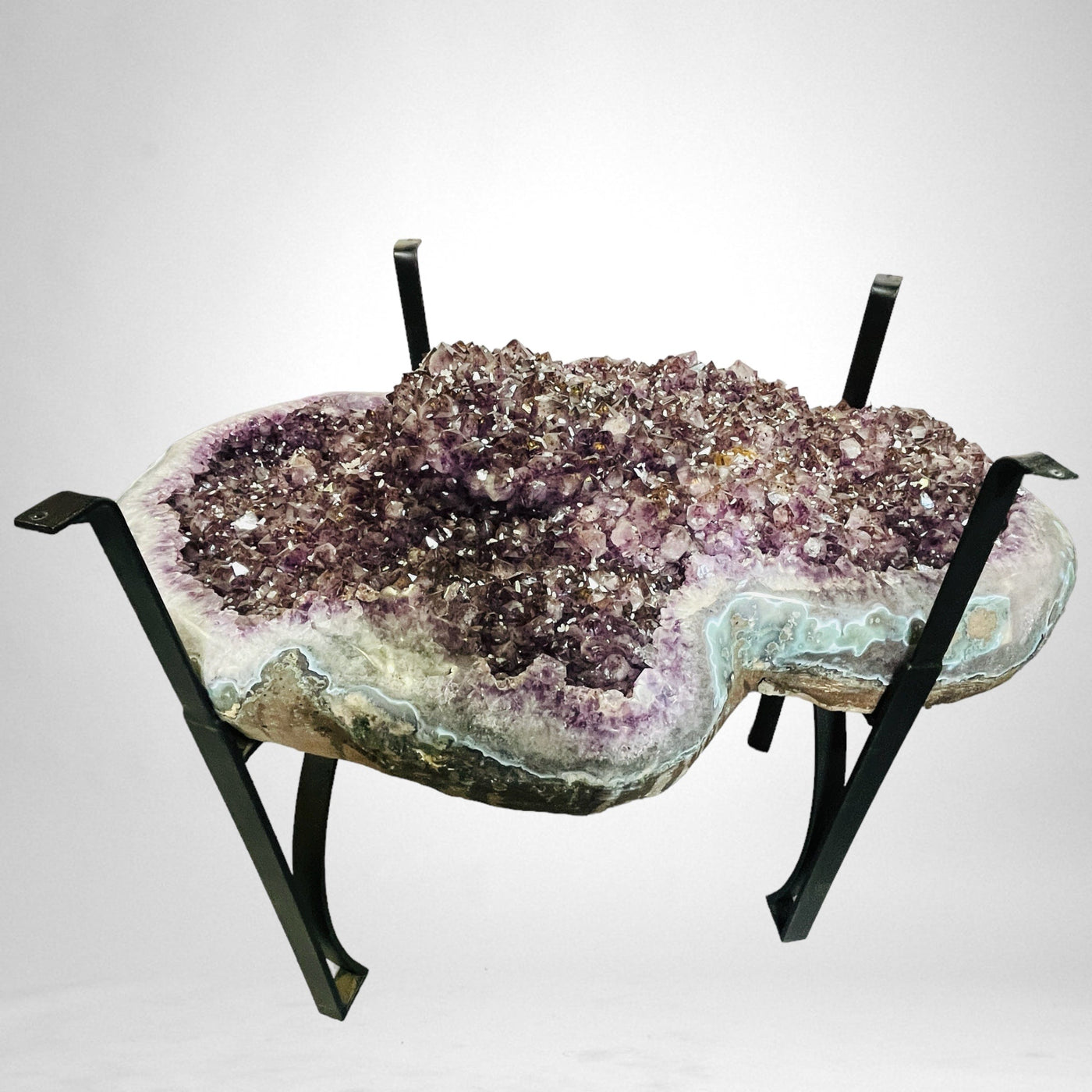 Amethyst Crystal Cluster Geode Table on Metal Base on white background
