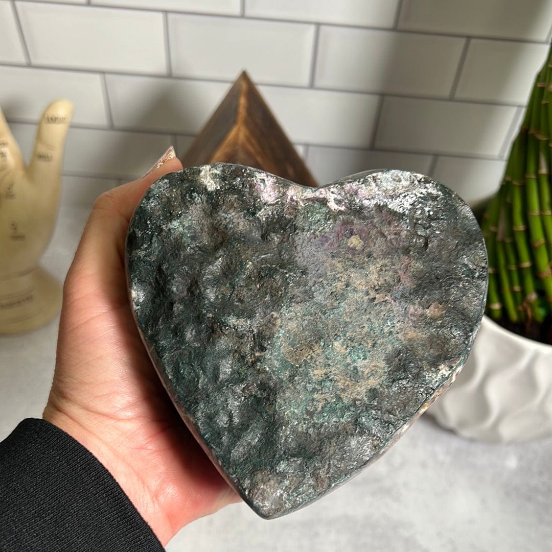 Backside of the heart which is green and gray rock