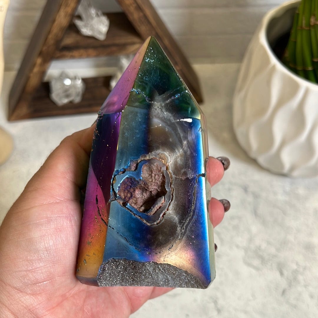 Rainbow coated titanium agate with a druzy center backside showing it has a heart shape opening and some cracking on the back