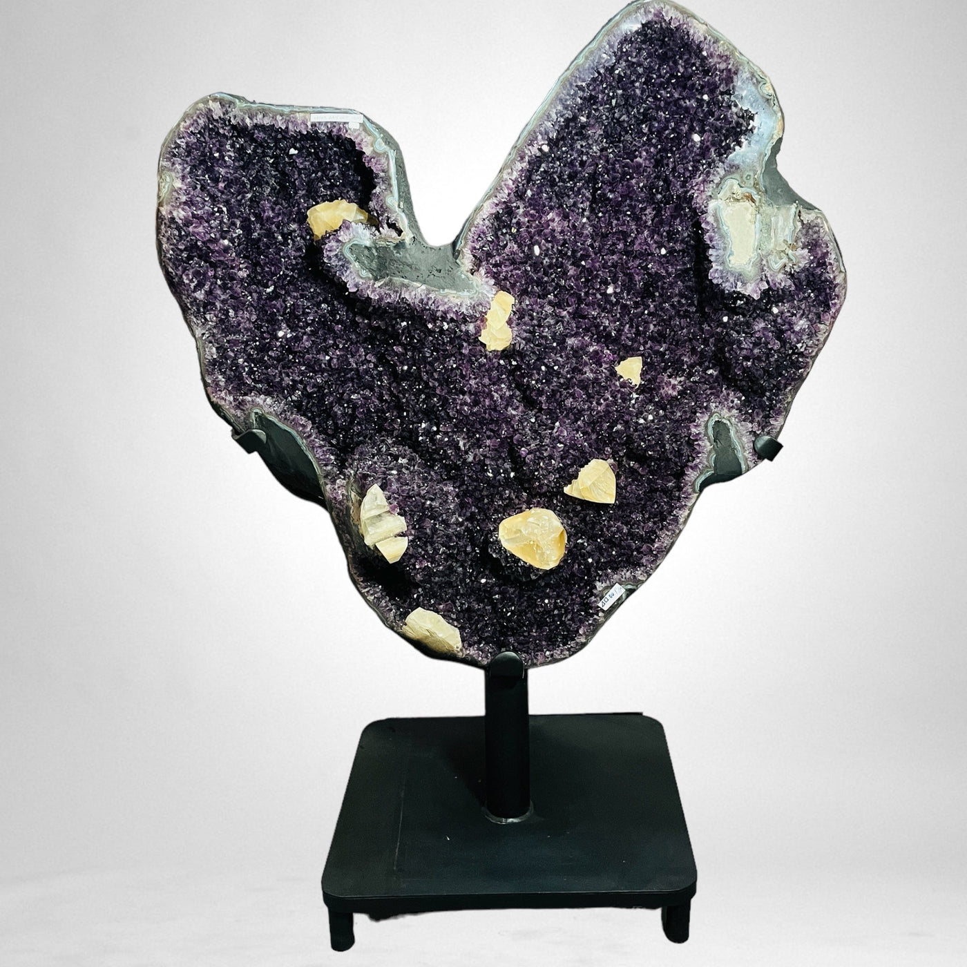 Amethyst Crystal Cluster Natural Shape Heart with Calcite Chunks on white background